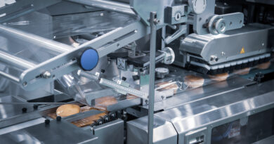 Bread, toast, bun plastic wrapping machine on bakery production line